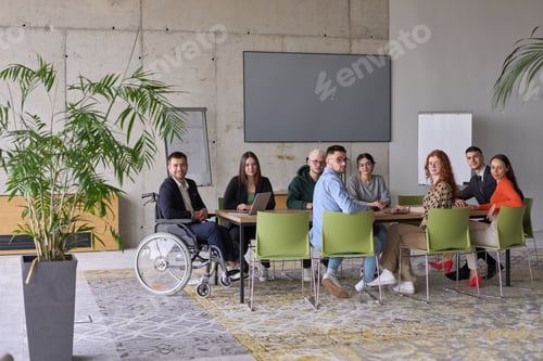 Preview: A diverse group of business professionals sitting in an office meeting with their director, who is