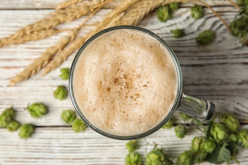 Preview: Flat lay composition with tasty beer, wheat spikes and fresh green hops on wooden background