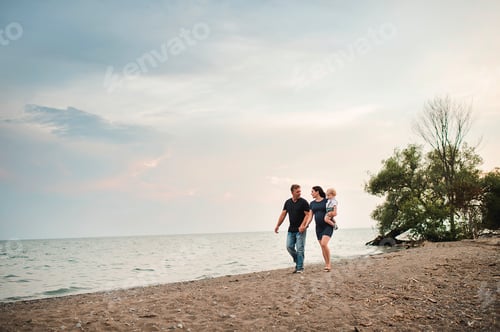 Preview: Pregnant couple strolling along beach with male toddler son, Lake Ontario, Canada