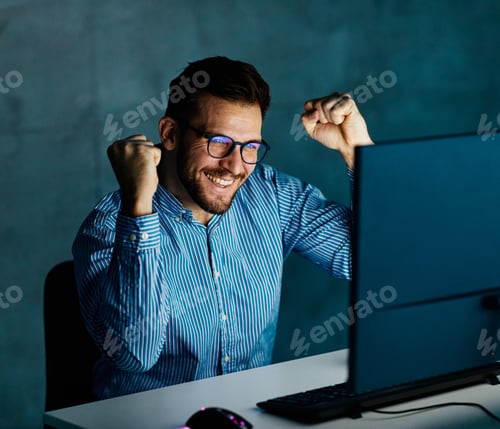 Preview: businessman working late night business computer man office winner win light dark young internet