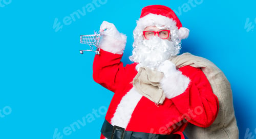 Preview: Funny Santa Claus have a fun with shopping cart