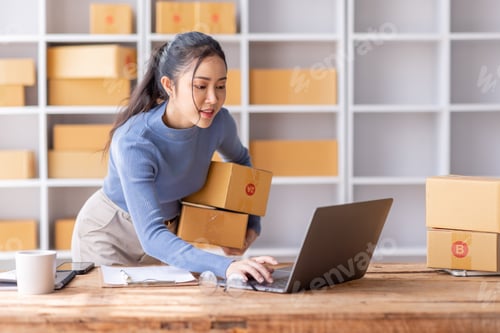 Preview: Portrait of Starting Asian female small businesses owners SME entrepreneur working at Laptop in home