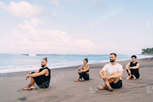 Preview: , calm group of hippies dressed in casual wear recreating on meditation practice yoga for health