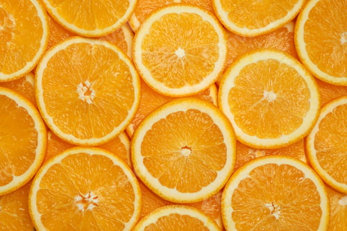 Preview: Fresh orange slices as background, top view