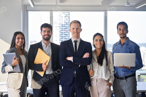 Preview: Young happy professional team business people standing in office. Portrait