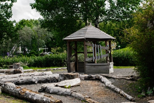 Preview: Wooden gazebo in a scenic parkland in Reykjavik, Iceland, surrounded by trees