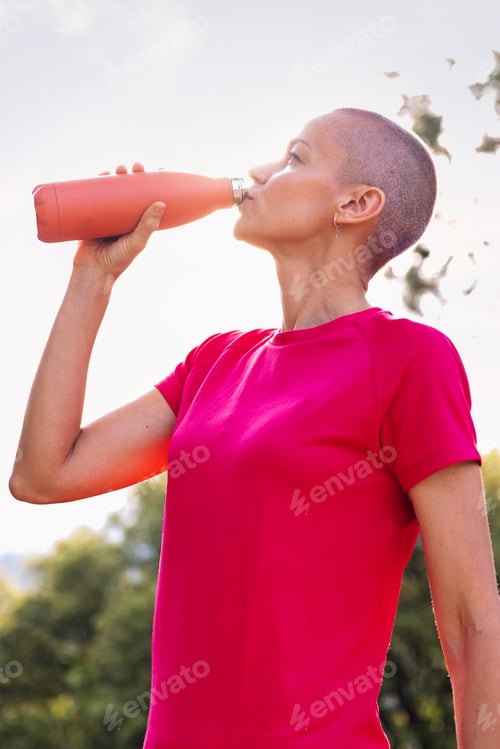 Preview: woman drinking water during her training