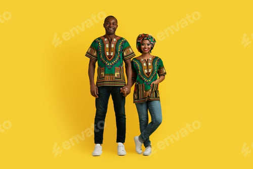 Preview: Happy traditional loving black couple posing on yellow