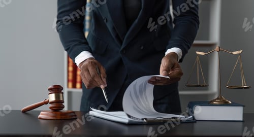 Preview: Male lawyer working at table in office