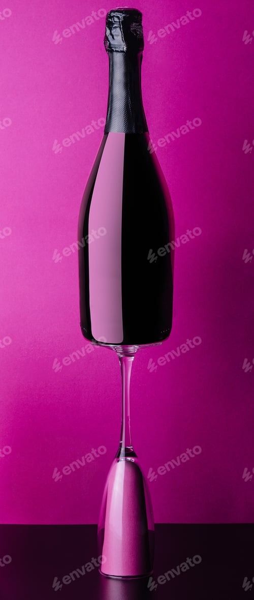 Preview: concept of bottle and glass of pink rose champagne