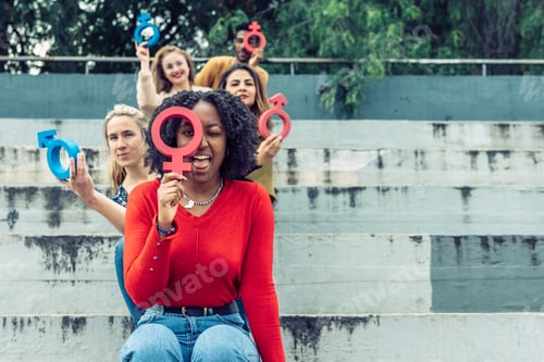 Preview: A black woman jokes with a female cork symbol in the foreground.