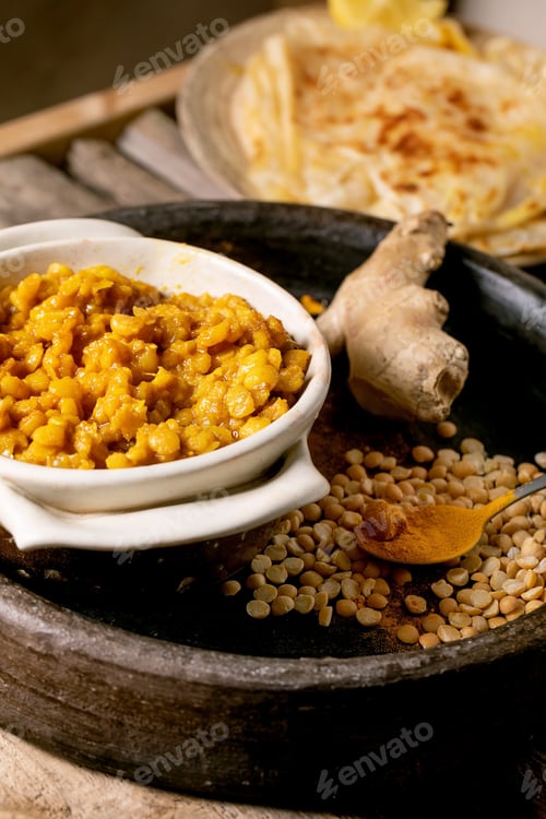 Preview: Traditional indian yellow pea food dal with roti bread