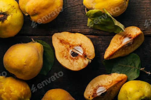 Fresh Quince Fruit on Dark Wooden Background