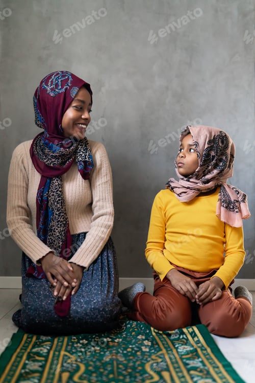 Preview: Muslim single parent. Portrait of a mother and child together at home