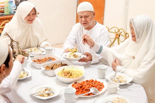 Preview: Mother serving ketupat lebaran at eid moment