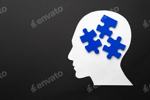 Preview: Papercut head with jigsaw puzzle pieces on black background