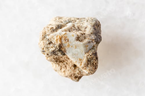 Preview: sample of raw achtarandite mineral on white marble