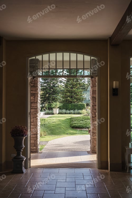 Preview: Antique entrance arch with flower vase and front garden