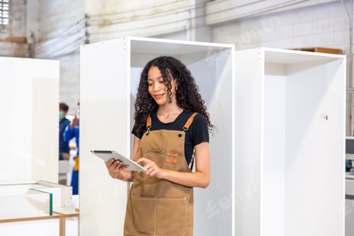 Preview: Woman with Tablet Checking Quality in Woodshop
