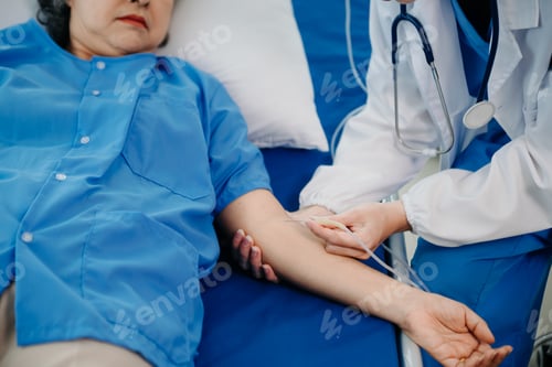 Preview: Caucasian doctor smiling take care of a young patient in hospital. Friendly nurse or therapeutic