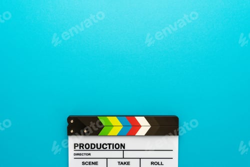 Preview: Top View Of Clapperboard At Bottom Of Turquoise Blue Background With Copy Space