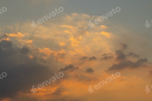 Preview: Sunset sky. Abstract nature background. Dramatic blue and orange, colorful clouds at twilight time.