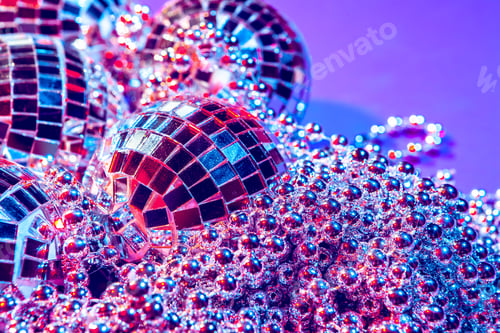 Preview: Shiny small disco balls sparkling in a beautiful purple light. Disco party concept