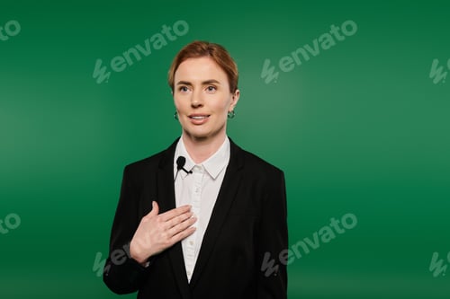 Preview: Engaging TV presenter in elegant black attire speaks on a green screen background