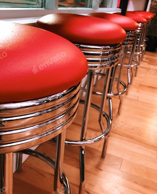 Preview: Red and chrome retro bar stools at a diner restaurant