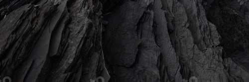 Preview: Black rock background. layered mountain surface close up. dark stone texture.