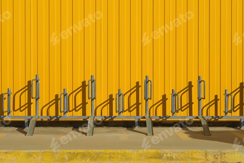 Preview: Bicycle parking near a bright yellow profiled metal wall