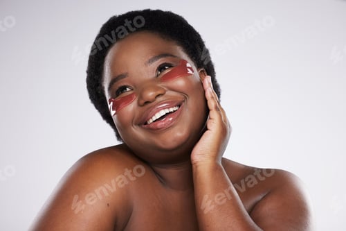 Preview: Black woman, face and smile with eye patch for skincare, healthy skin and glow isolated on studio b