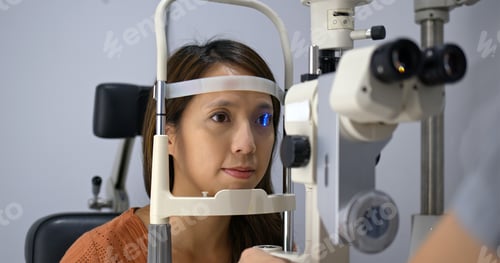 Preview: Woman undergo checking eye in clinic