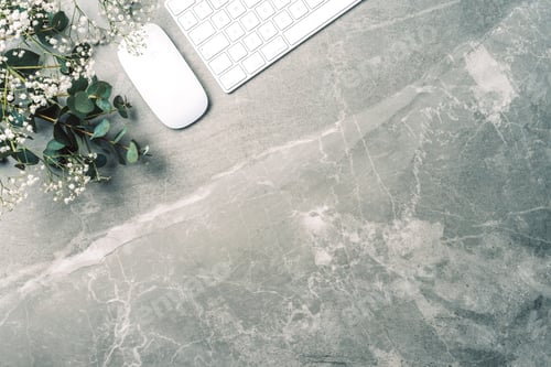 Preview: Feminine workspace. White computer keyboard, mouse, gypsophila flowers, eucalyptus flowers on marble
