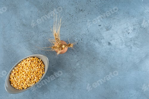 Preview: Yellow pea beans in a bowl on blue background