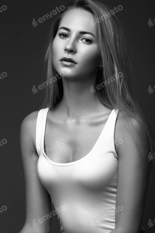 Preview: fashion model with long hair, young European attractive, perfect skin is posing in studio for test
