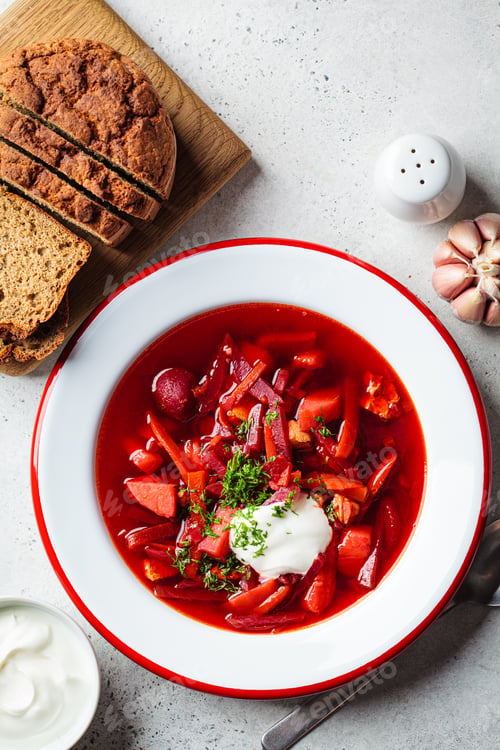 Preview: Beetroot soup borsch with garlic, sour cream and dill in plate.