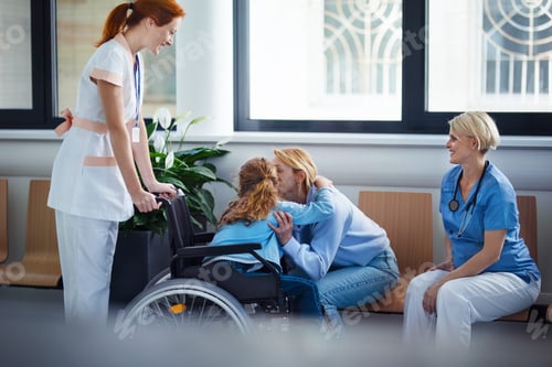 Preview: Little girl on wheelchair greeting with her mother in hospital.