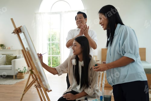 Preview: Group enjoys painting together in a bright, cozy indoor studio setting
