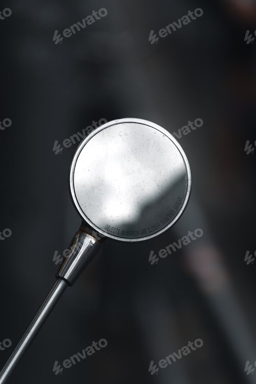 Preview: Close-up of a round side mirror with the text 'Objects in mirror are closer than they appear'