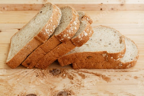 Preview: Close up sliced whole wheat bread baked and cereal on wooden background