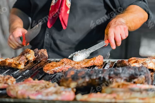 Preview: Chef Grilling Steaks Over Open Flame