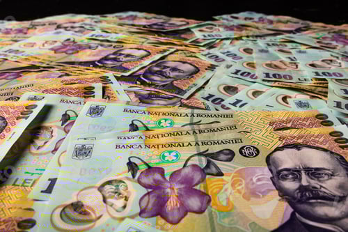 Preview: Closeup of the Romanian LEI bill pile spread on a table