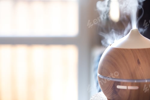 Preview: Modern oil aroma diffuser close up on a blurred background.