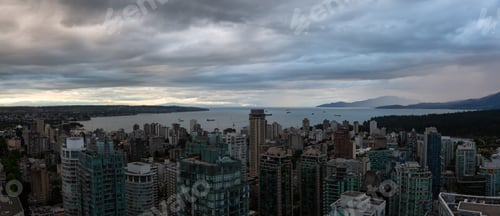 Preview: Aerial view of Downtown City during a stormy summer evening before sunset