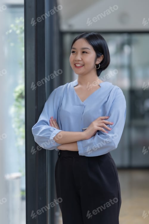 Preview: Crossed arms. Confident Asian Businesswoman Standing in Office.