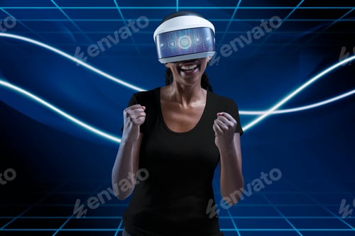 Preview: Woman with VR headset cheering with excitement