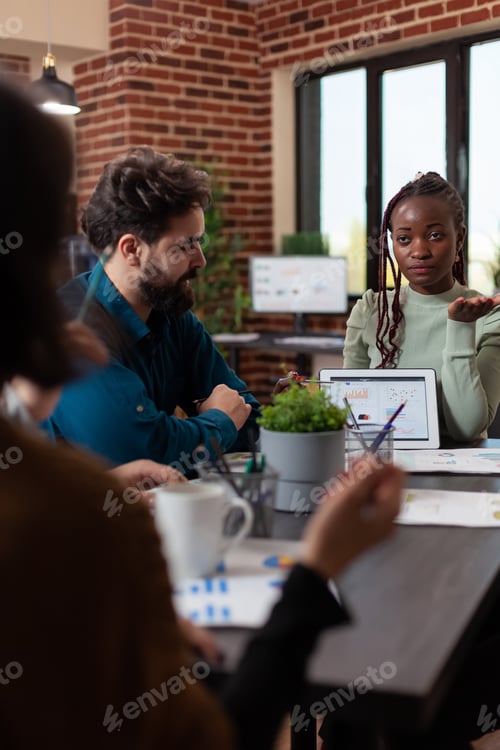 Preview: African american businesswoman showing marketing graphs
