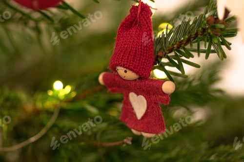 Preview: Closeup of christmas ornaments hanging on a tree