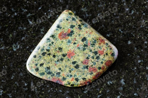 Preview: sample of polished epidosite rock on black granite